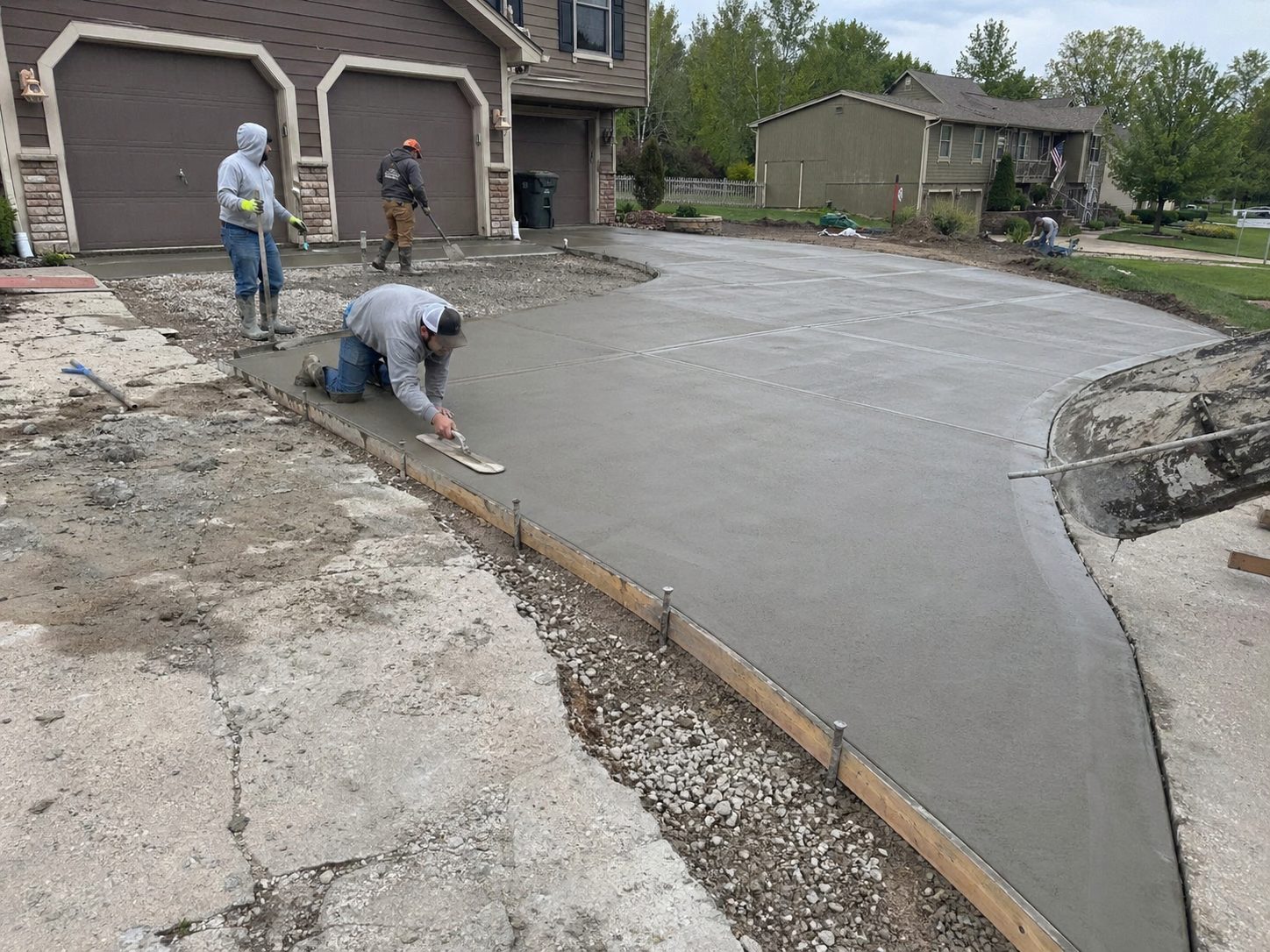 Concrete driveway pour in progress at a Harrisonville, MO residential property